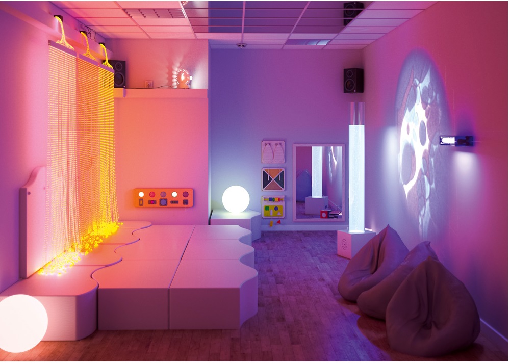 Biała sala z elementami świetlnymi, służąca do integracji sensorycznej.